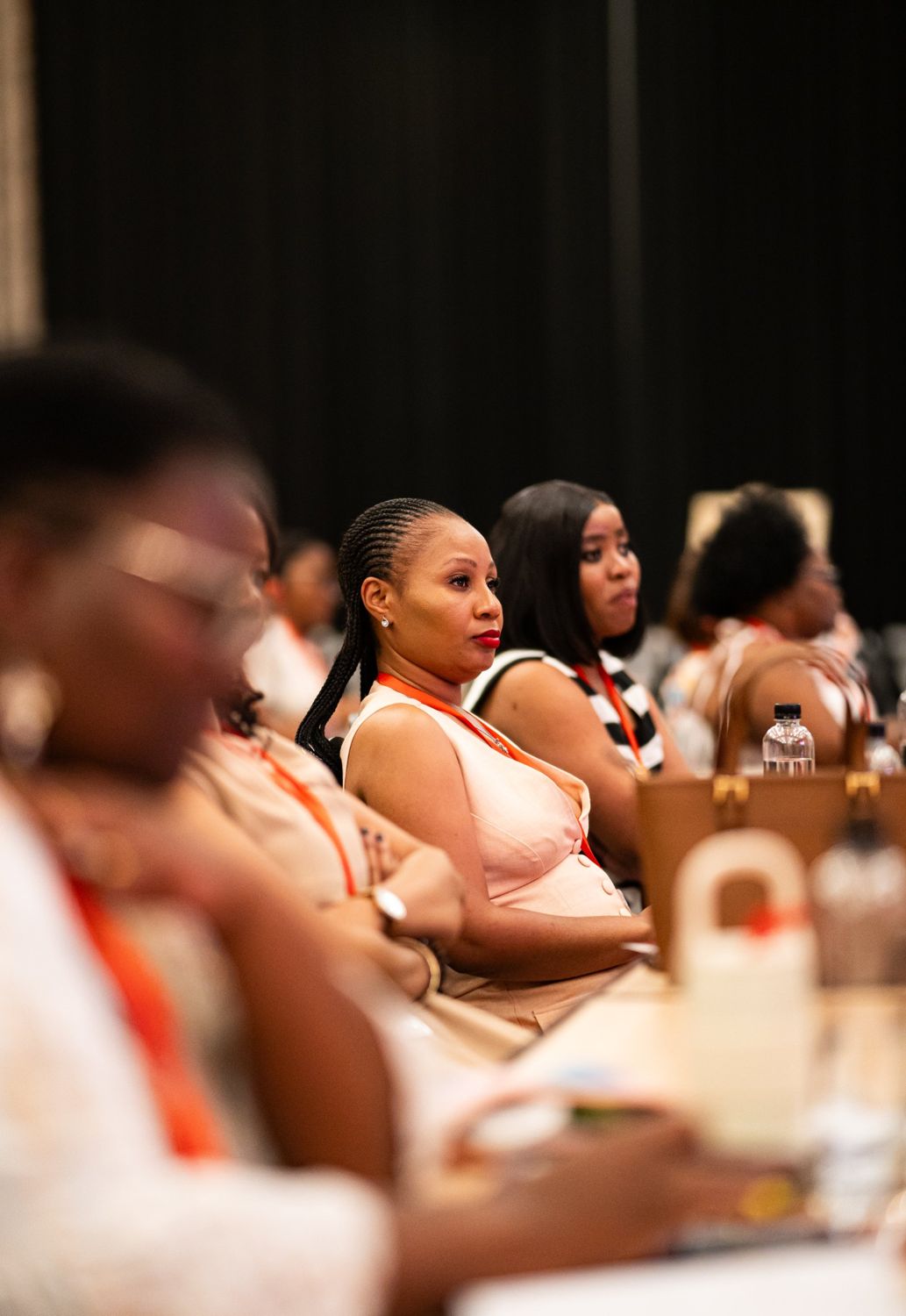Delegates listening during a session