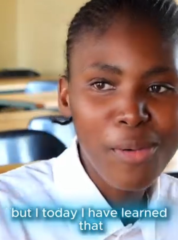 Learner speaking to camera with burned-in captions